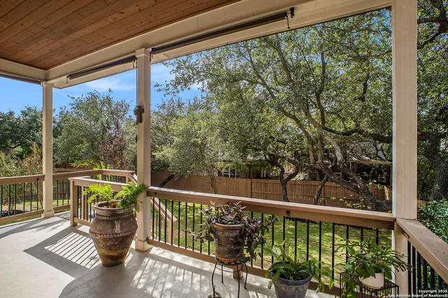 a view of a balcony with wooden floor