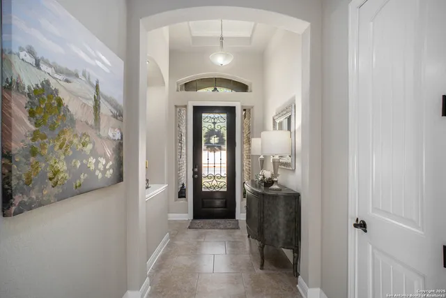 a view of a hallway view with wooden floor and workspace