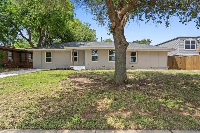 a house with trees in the background