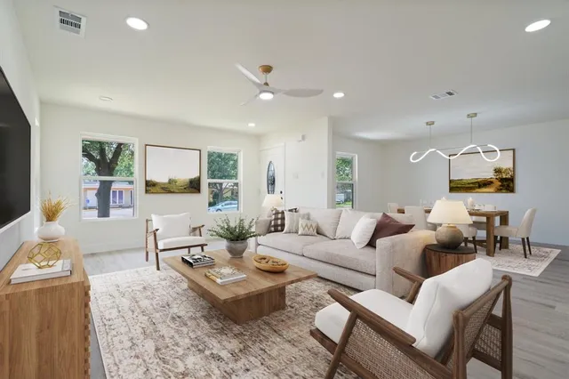 a living room with furniture and a table