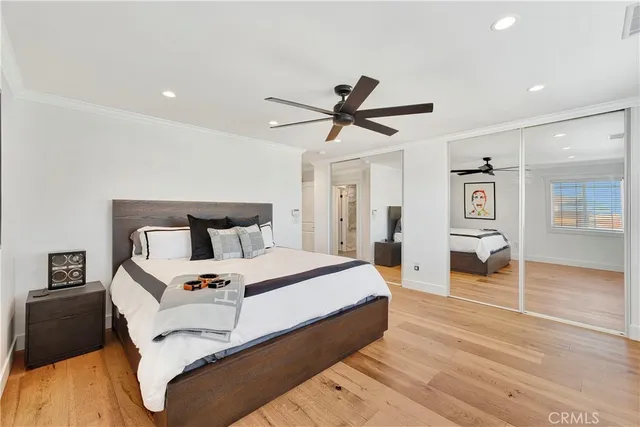 a bedroom with bed and window