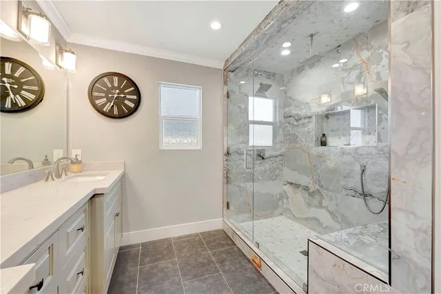 a bathroom with a double vanity sink and a mirror