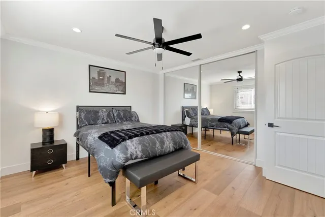 a work room with furniture a rug and a window
