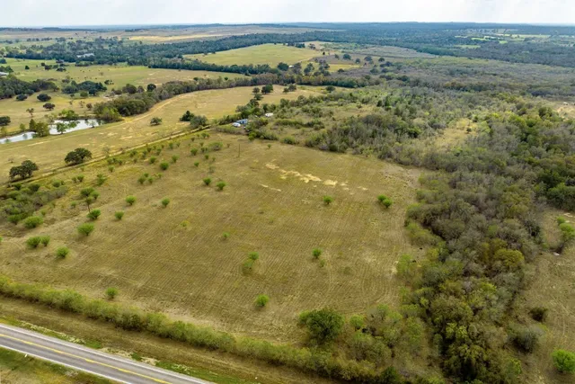 a view of a field with an ocean view
