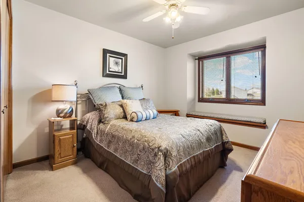 a view of a house with a big yard and potted plants