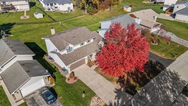 an aerial view of houses with yard