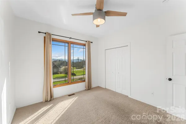 a view of a room with a large window