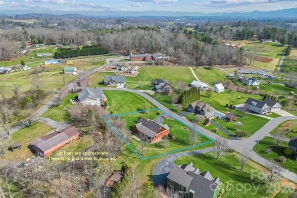 an aerial view of a house with a garden