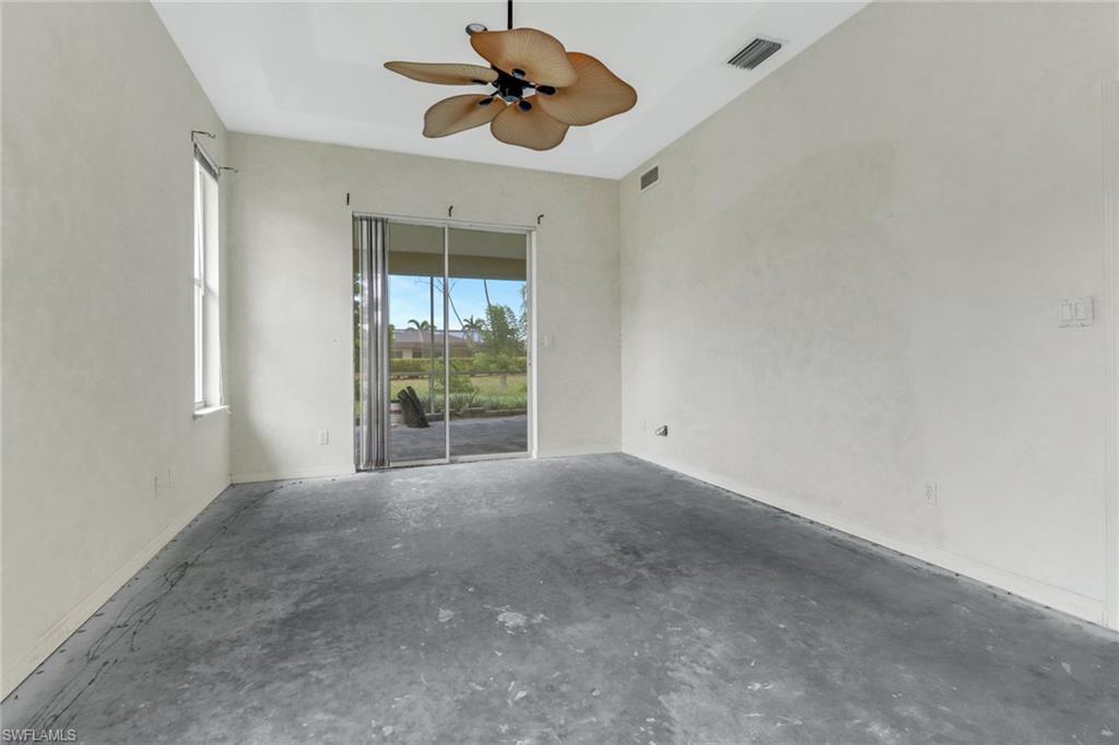 481 Raven Way Naples, FL 34110 - Photo 14 of 30 a view of an empty room with a window