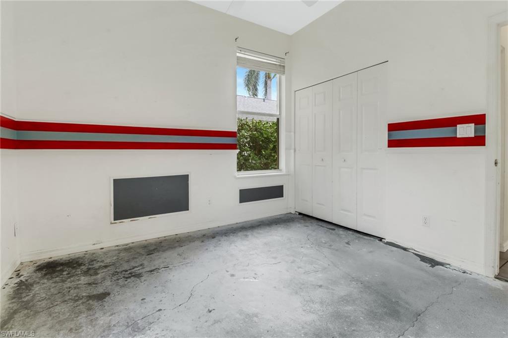 481 Raven Way Naples, FL 34110 - Photo 18 of 30 a view of an empty room