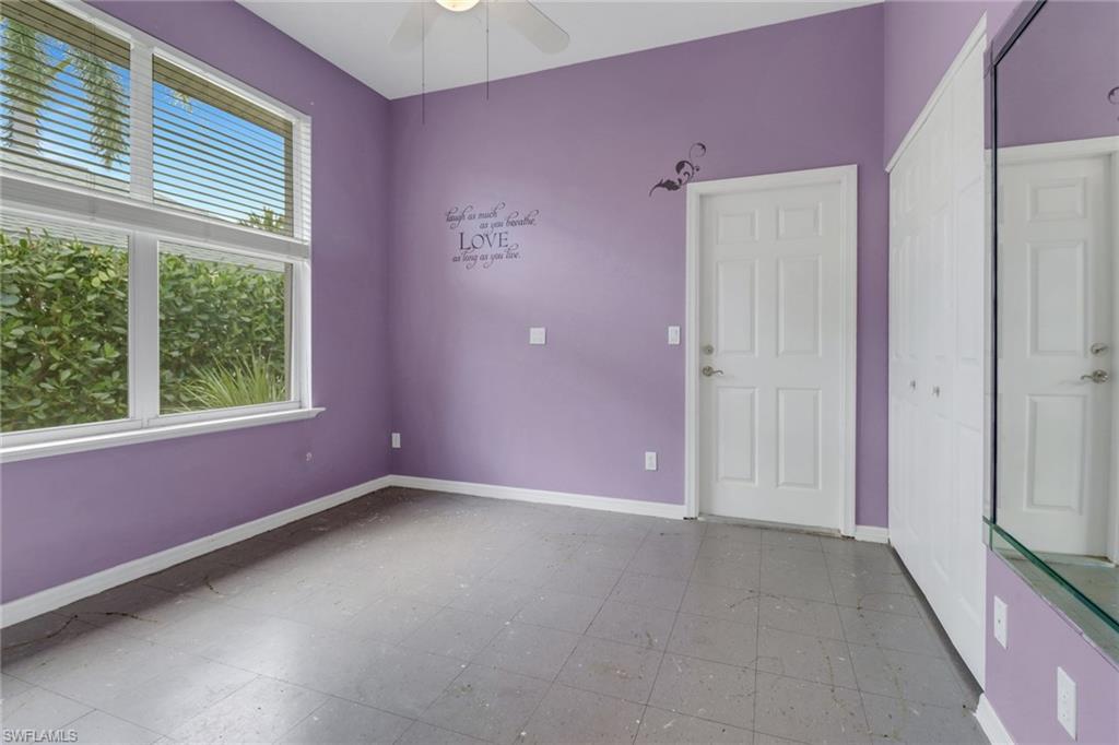 481 Raven Way Naples, FL 34110 - Photo 19 of 30 an empty room with a window