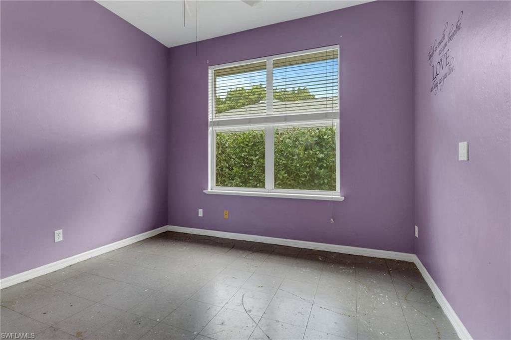 481 Raven Way Naples, FL 34110 - Photo 20 of 30 an empty room with a window
