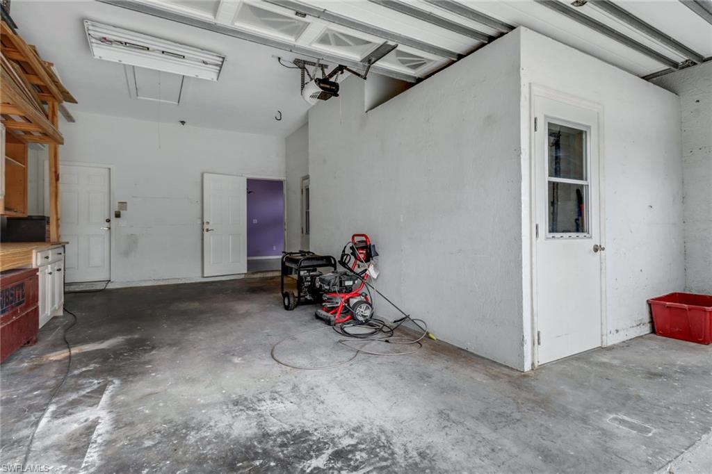481 Raven Way Naples, FL 34110 - Photo 24 of 30 a view of a room with gym equipment