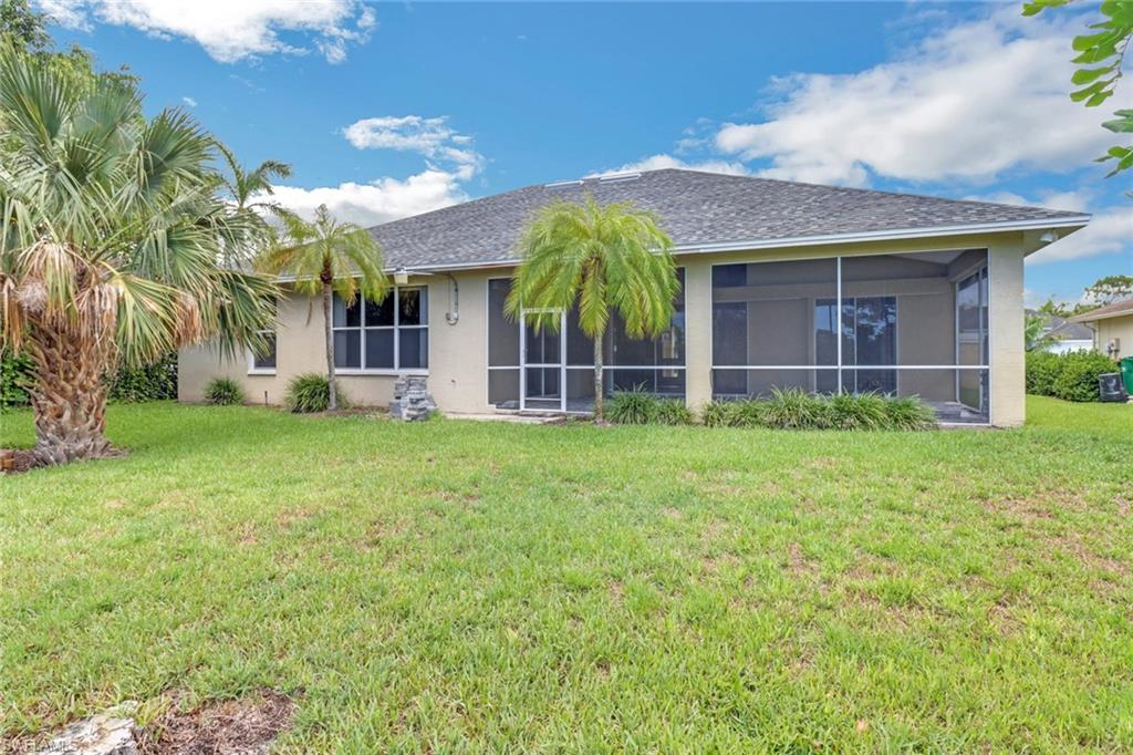 481 Raven Way Naples, FL 34110 - Photo 27 of 30 a view of a house with a yard and plants
