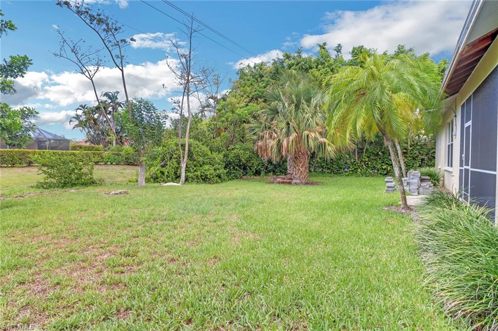 481 Raven Way Naples, FL 34110 - Photo 28 of 30 a view of a backyard with a garden
