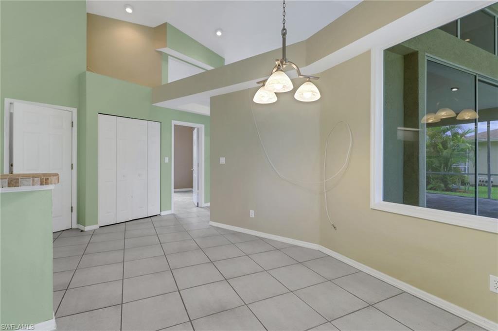 481 Raven Way Naples, FL 34110 - Photo 10 of 30 a view of an empty room with a window