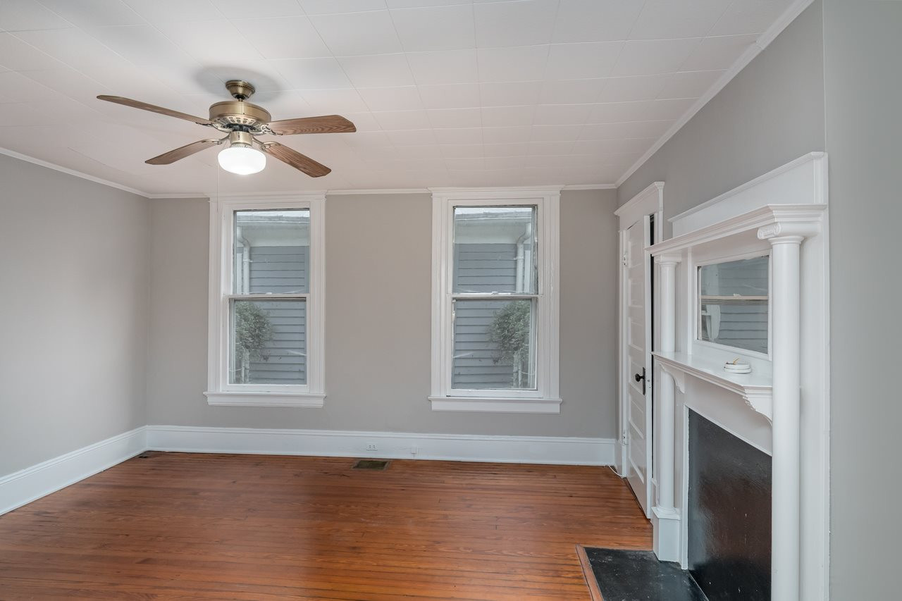 109 North Bloodworth Street Raleigh, NC 27601 - Photo 14 of 30 a view of an empty room with wooden floor and a window