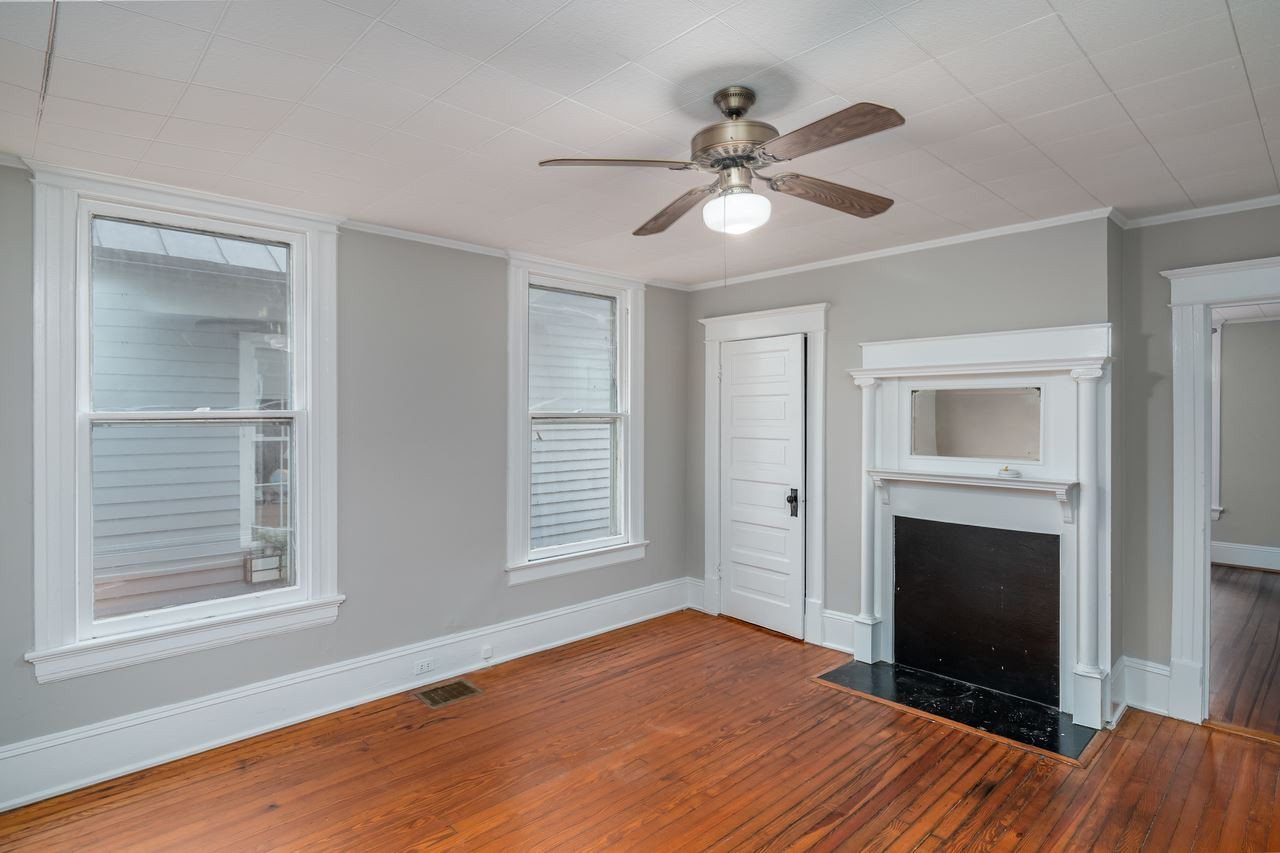 109 North Bloodworth Street Raleigh, NC 27601 - Photo 15 of 30 a view of an empty room with a window and wooden floor