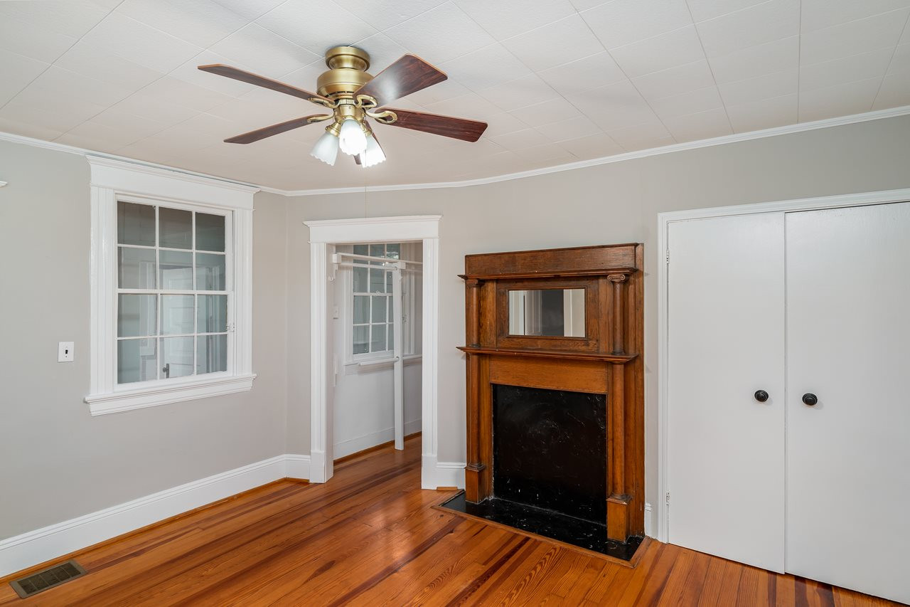109 North Bloodworth Street Raleigh, NC 27601 - Photo 16 of 30 a view of an empty room with wooden floor and a window