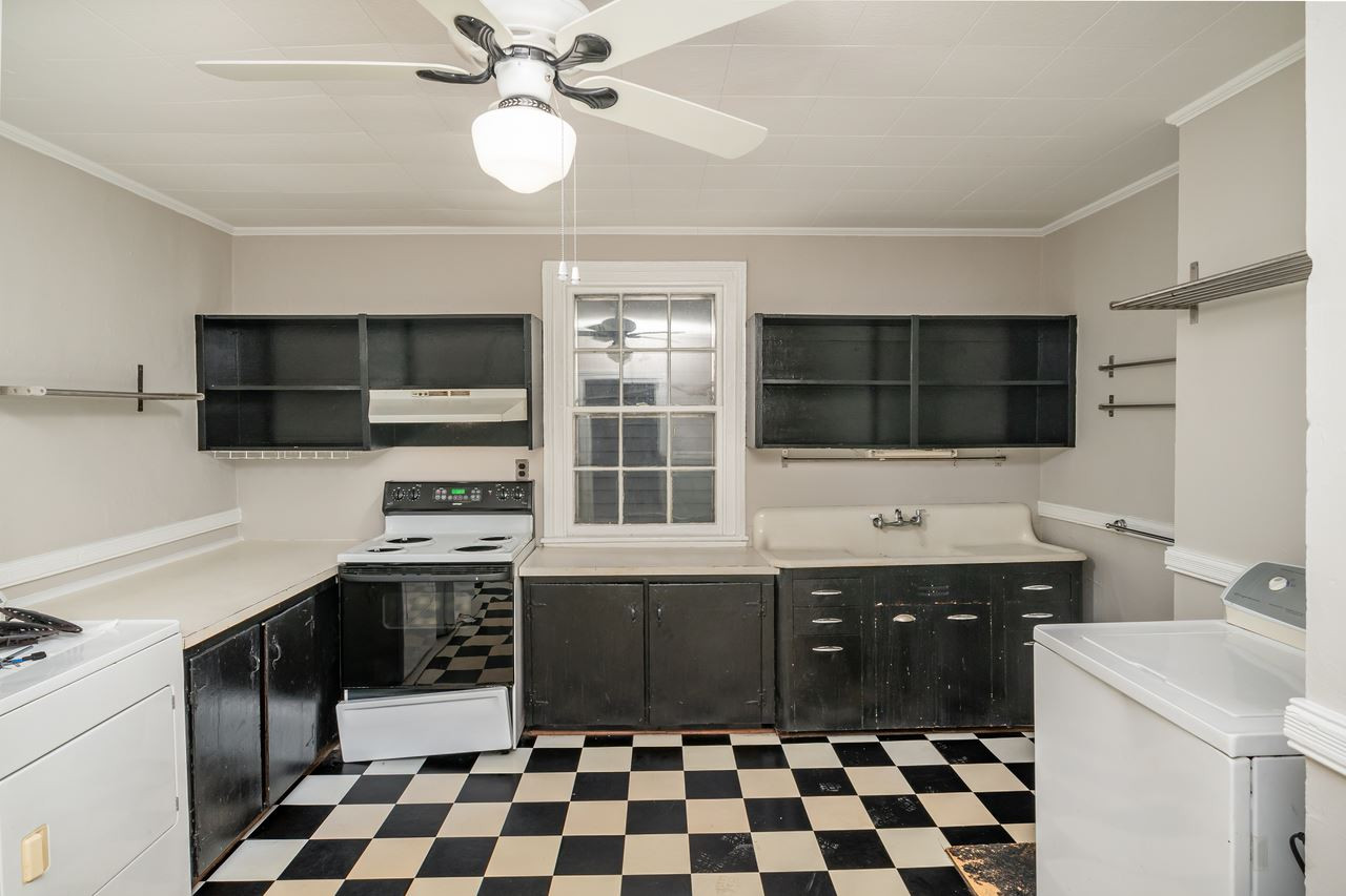 109 North Bloodworth Street Raleigh, NC 27601 - Photo 24 of 30 a kitchen with a sink a stove and microwave