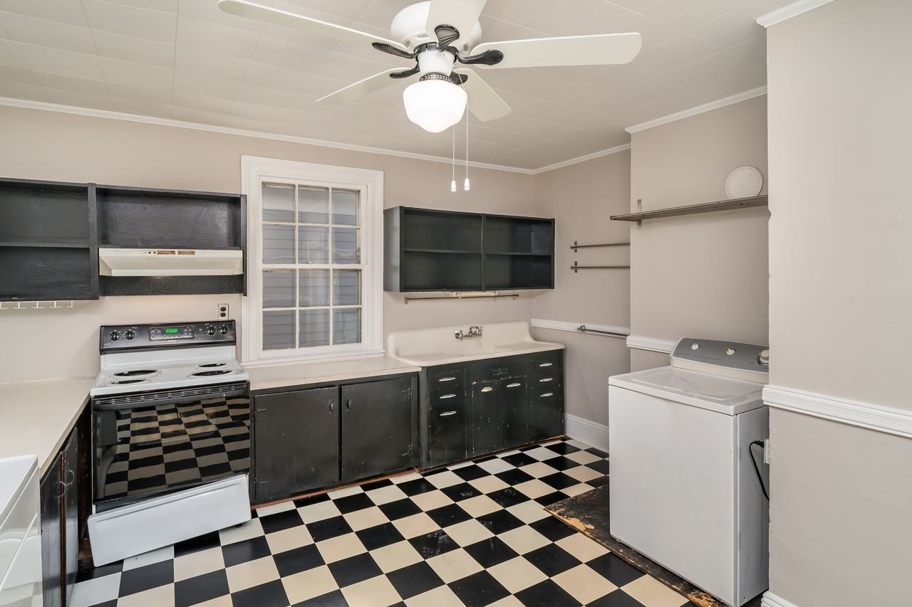 109 North Bloodworth Street Raleigh, NC 27601 - Photo 25 of 30 a kitchen with a sink stove and microwave