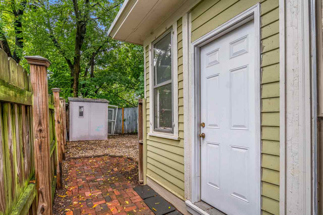 109 North Bloodworth Street Raleigh, NC 27601 - Photo 6 of 30 a view of a house with a door and wooden walls