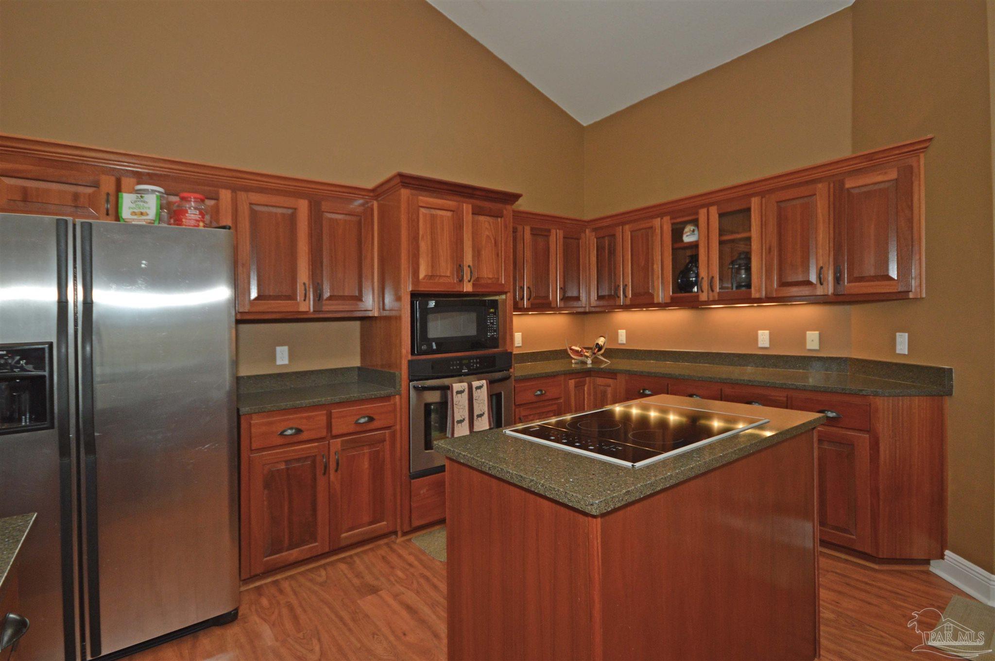 3478 Pine Level Church Road Jay, FL 32565 - Photo 19 of 50 a kitchen with granite countertop a sink stove and refrigerator