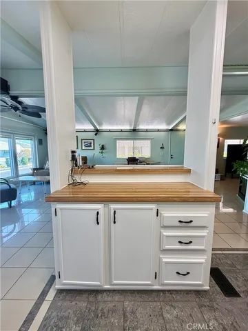 a lobby with furniture and a potted plant