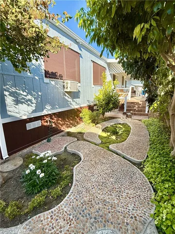 a view of a patio with a table and chairs