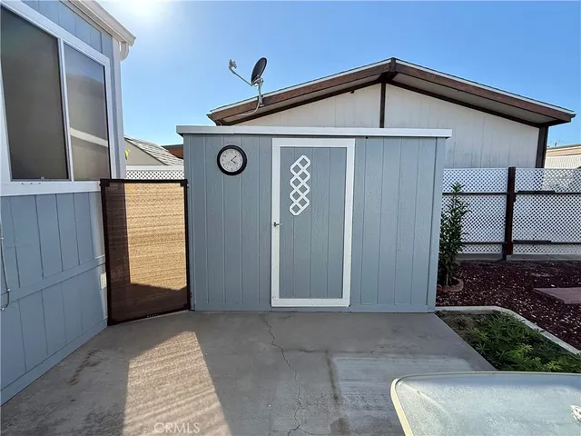 a view of a patio with table and chairs