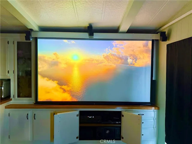 a kitchen with a refrigerator and a sink