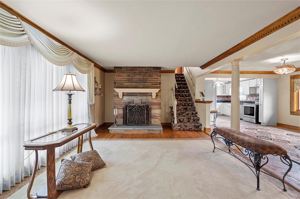 391 Golden Grove Road Baden, PA 15005 - Photo 13 of 34 a living room with furniture pool table and a fireplace