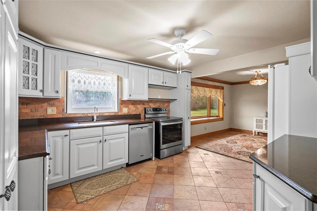 391 Golden Grove Road Baden, PA 15005 - Photo 18 of 34 a kitchen with a stove a sink and a refrigerator