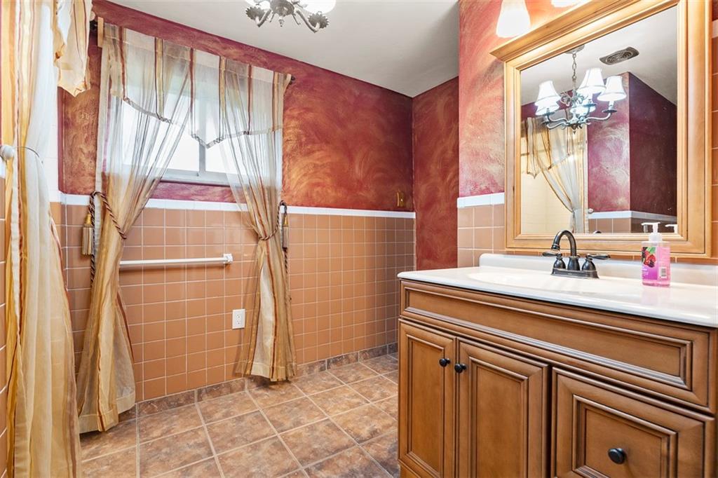 391 Golden Grove Road Baden, PA 15005 - Photo 20 of 34 a bathroom with a sink and a mirror