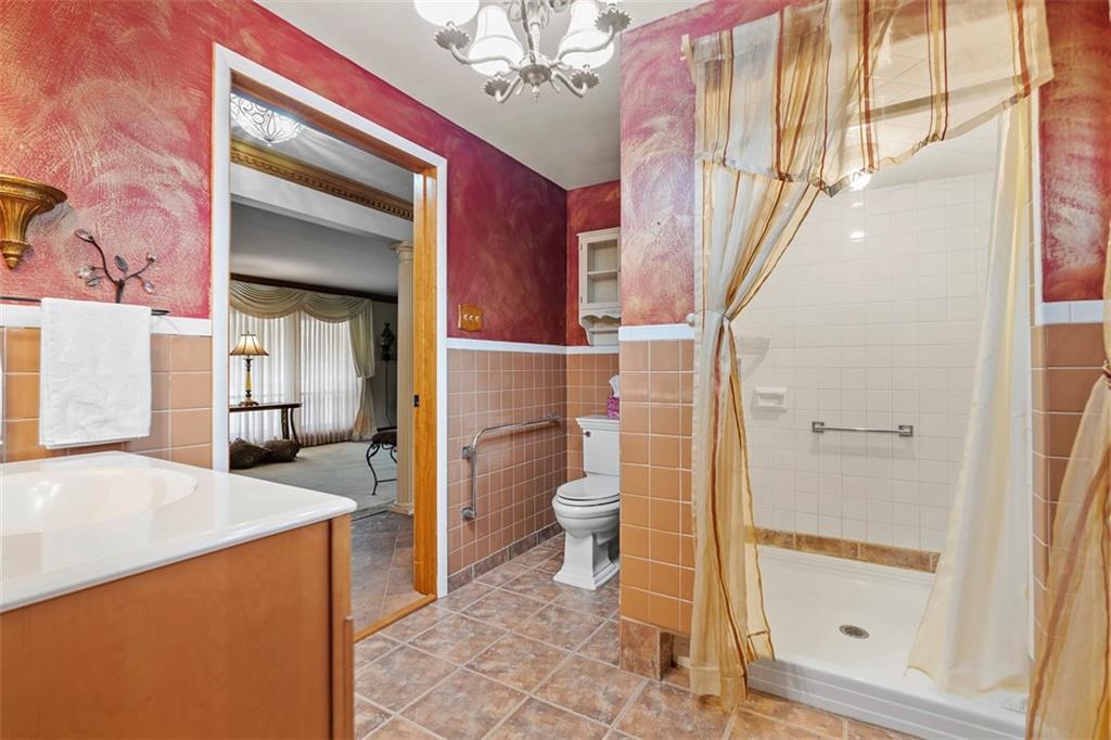 391 Golden Grove Road Baden, PA 15005 - Photo 21 of 34 a bathroom with a sink and a mirror