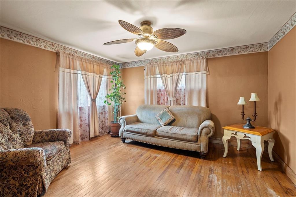 391 Golden Grove Road Baden, PA 15005 - Photo 22 of 34 a living room with furniture and a large window