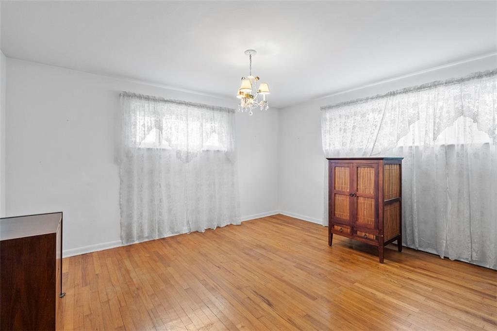 391 Golden Grove Road Baden, PA 15005 - Photo 25 of 34 wooden floor in an empty room with a window