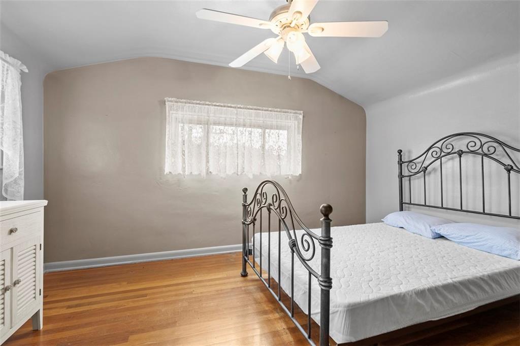 391 Golden Grove Road Baden, PA 15005 - Photo 27 of 34 a bedroom with a bed and a large window