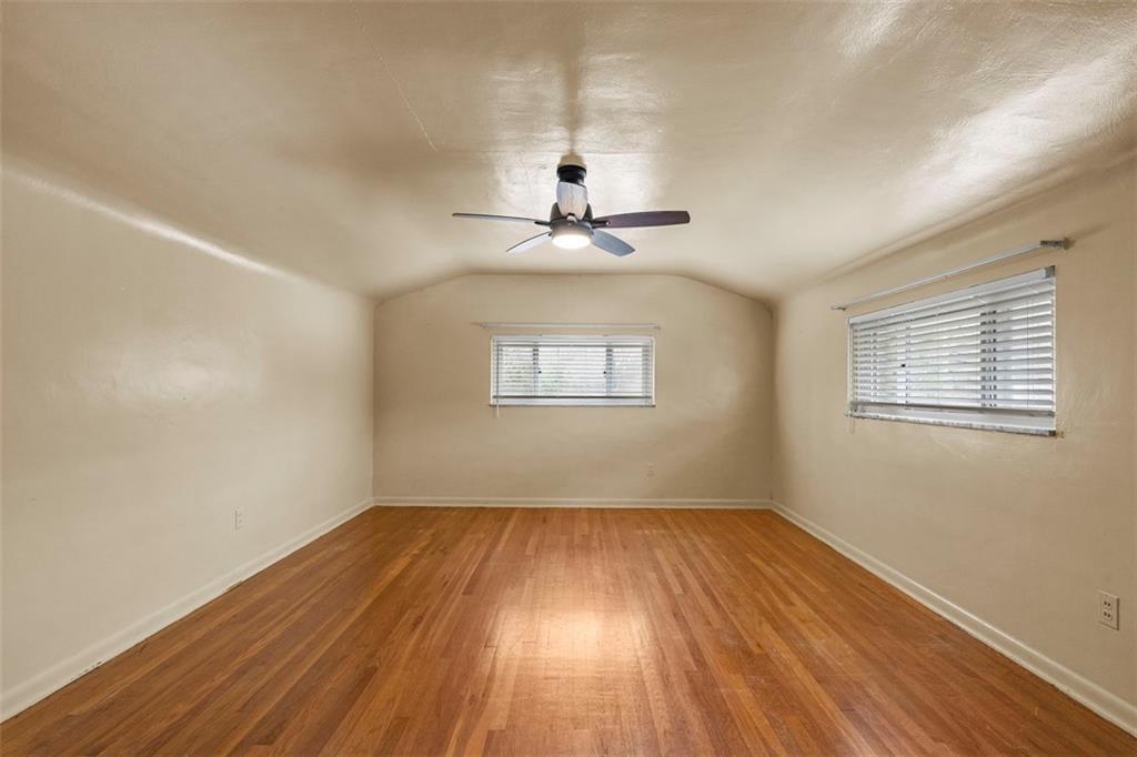 391 Golden Grove Road Baden, PA 15005 - Photo 29 of 34 a view of empty room with wooden floor and fan