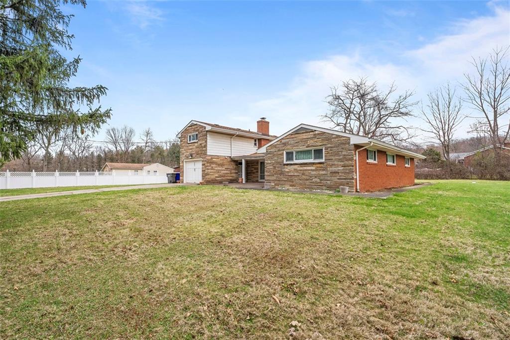 391 Golden Grove Road Baden, PA 15005 - Photo 6 of 34 a front view of a house with a yard