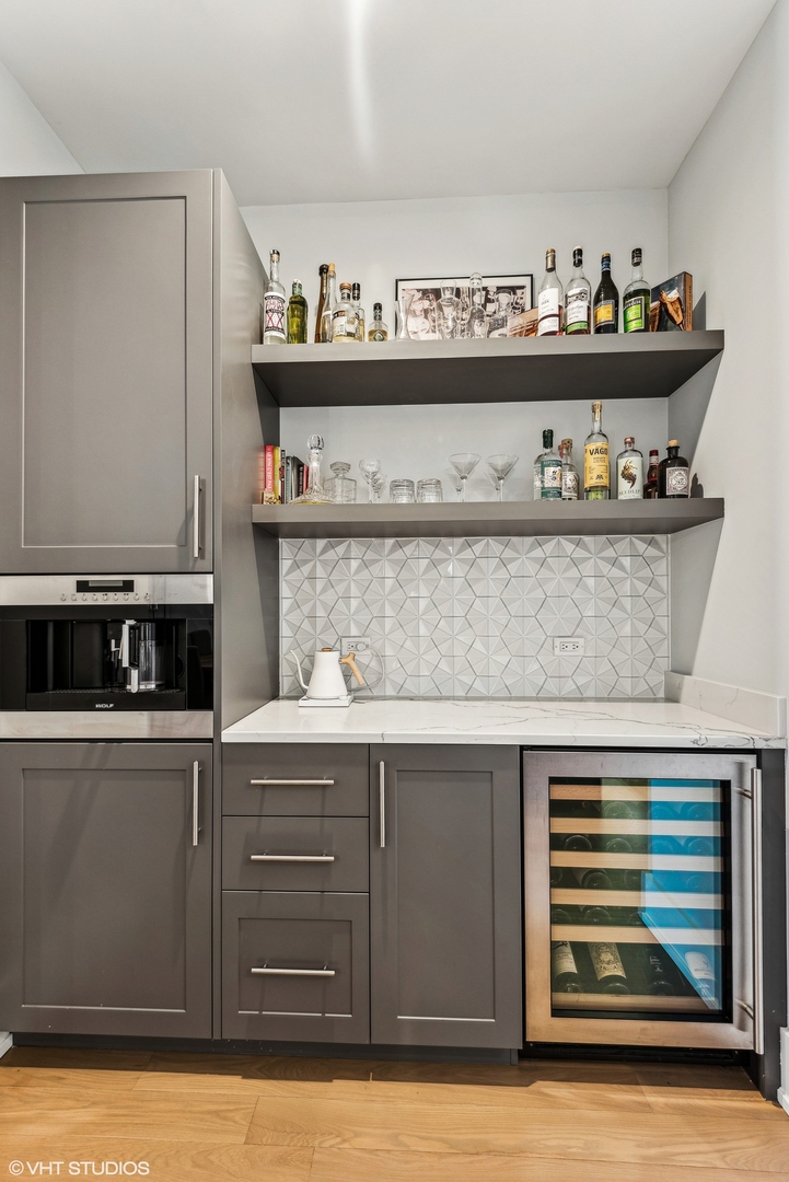 220 South Green Street, Unit 3N Chicago, IL 60607 - Photo 13 of 34 a kitchen with a cabinets and wooden floor