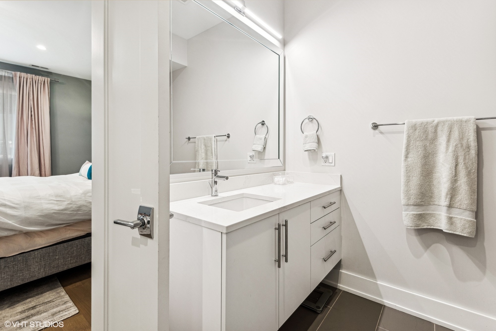 220 South Green Street, Unit 3N Chicago, IL 60607 - Photo 19 of 34 a bathroom with a sink a mirror and a shower