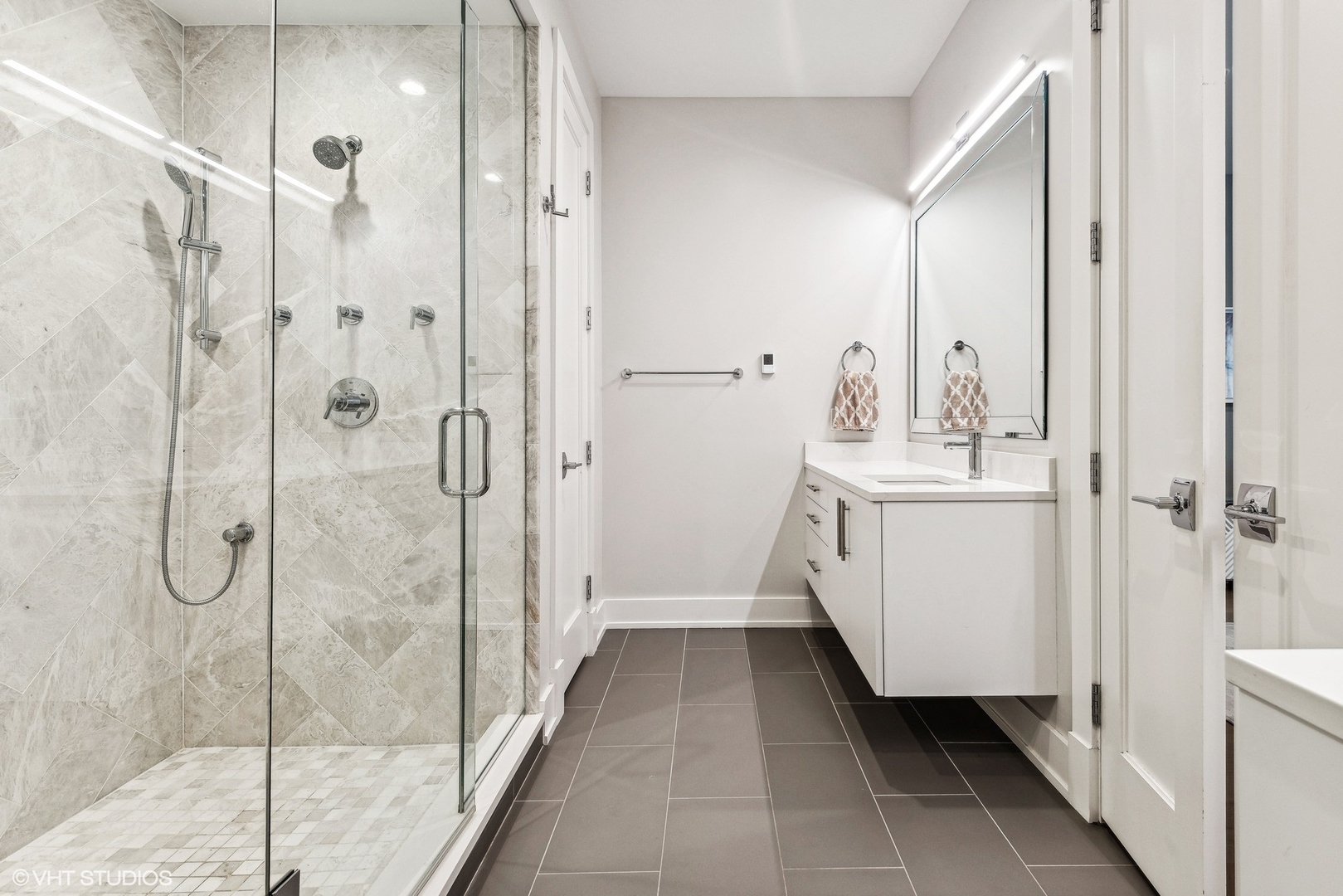 220 South Green Street, Unit 3N Chicago, IL 60607 - Photo 20 of 34 a bathroom with a double vanity sink and shower