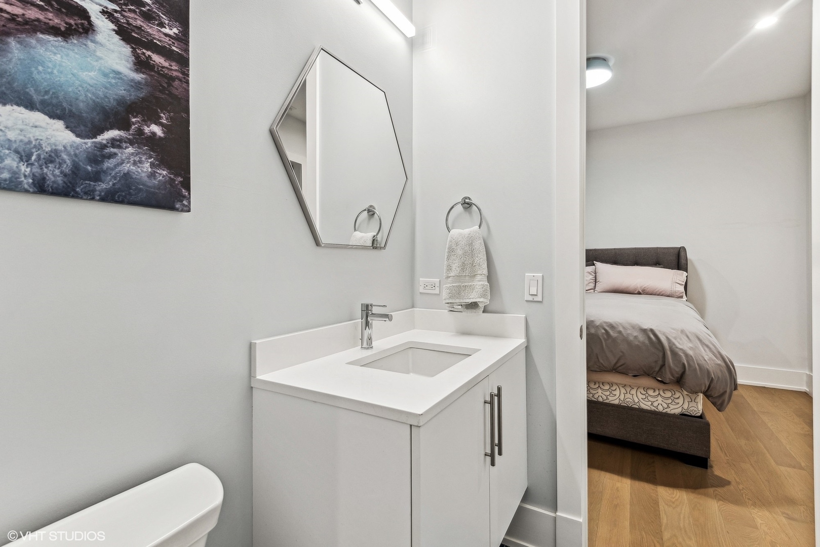 220 South Green Street, Unit 3N Chicago, IL 60607 - Photo 25 of 34 a bathroom with a toilet sink and mirror