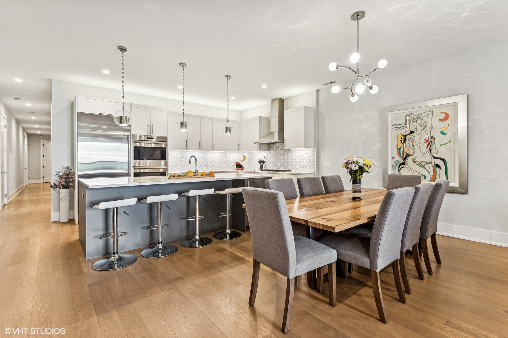 220 South Green Street, Unit 3N Chicago, IL 60607 - Photo 8 of 34 a large kitchen with a table and chairs