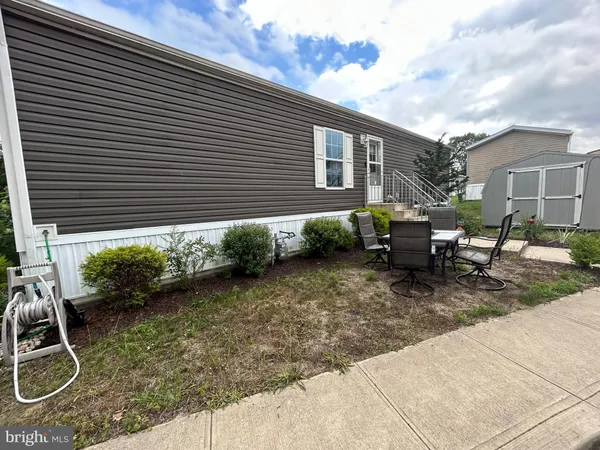 a view of backyard with patio