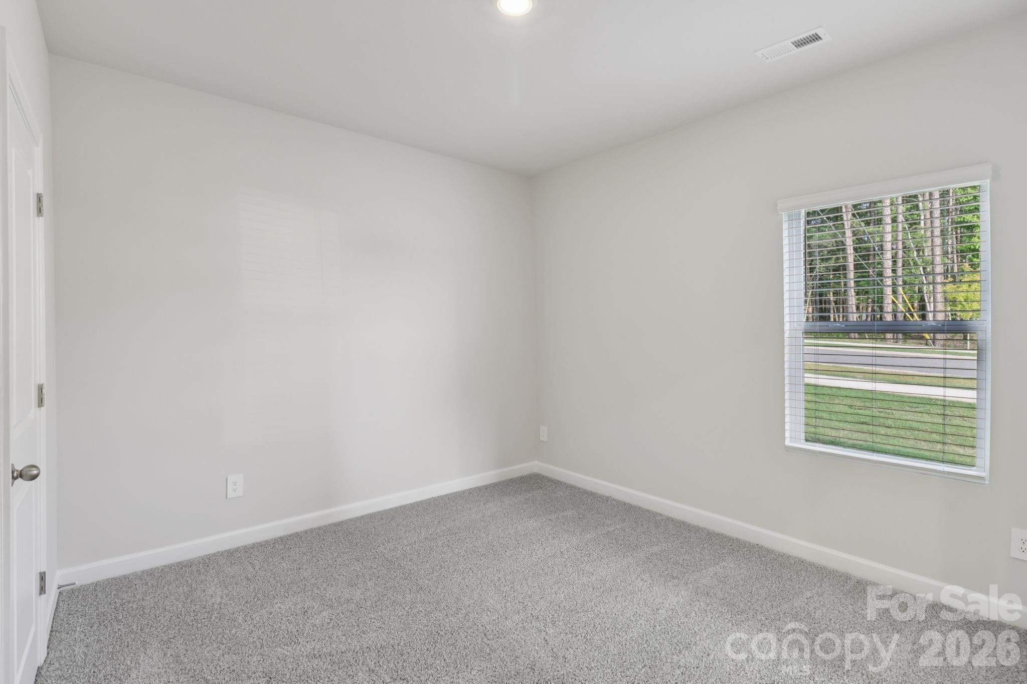 2449 Chartwell Street Stanley, NC 28164 - Photo 12 of 23 an empty room with a window