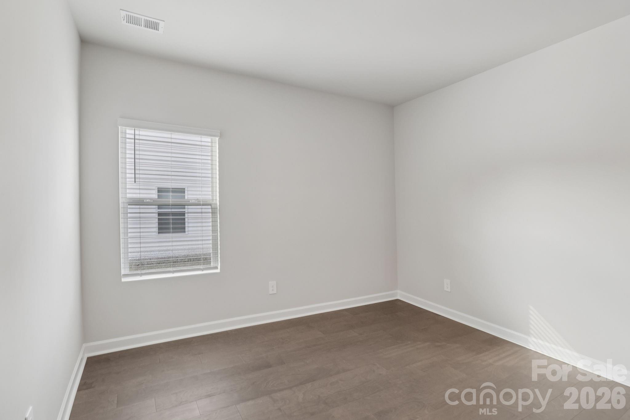 2449 Chartwell Street Stanley, NC 28164 - Photo 22 of 23 an empty room with a window