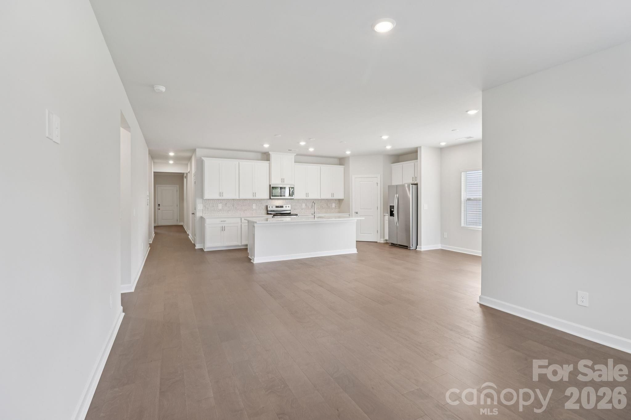 2449 Chartwell Street Stanley, NC 28164 - Photo 8 of 23 a view of a kitchen with refrigerator and a sink