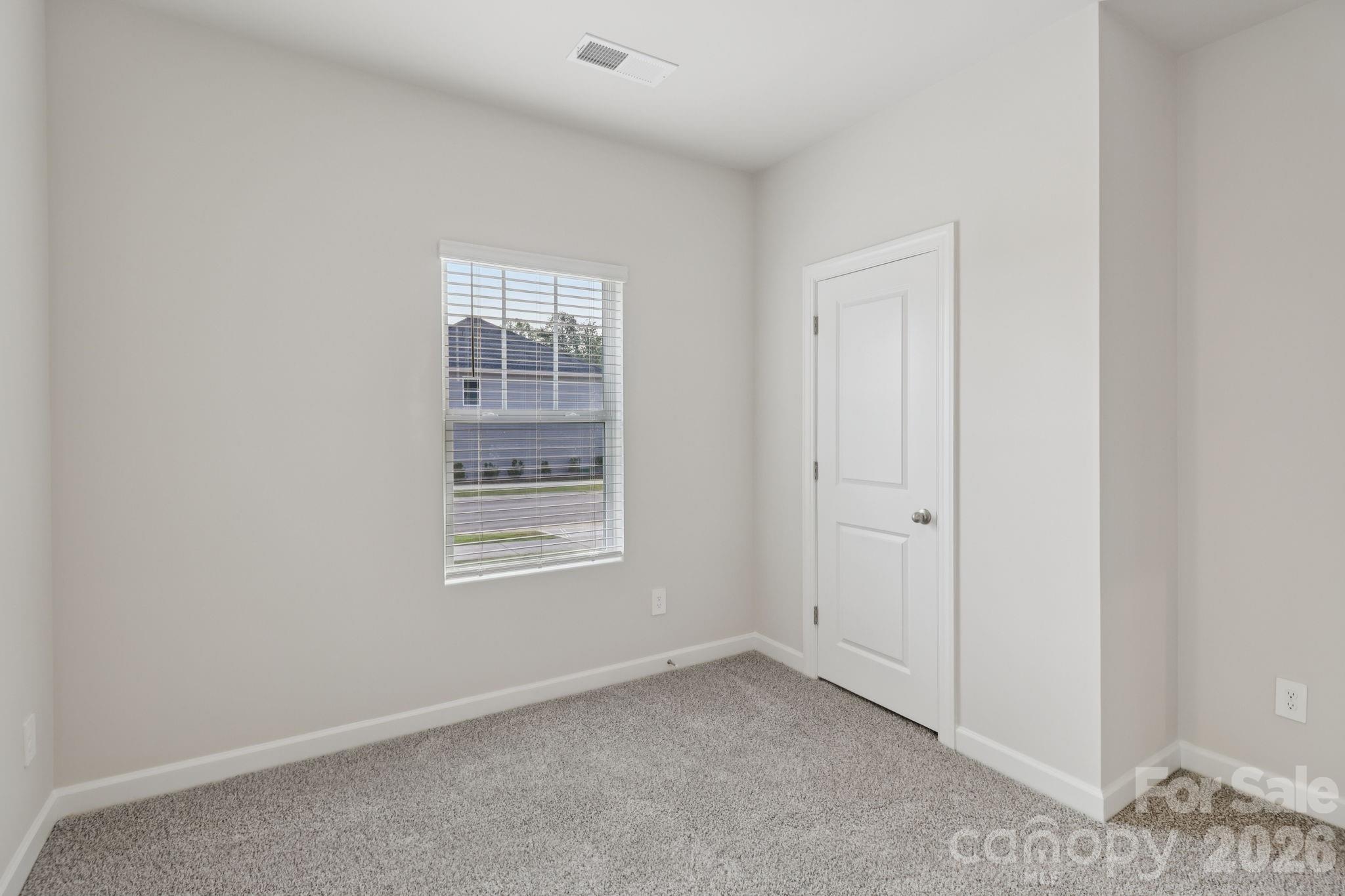 2449 Chartwell Street Stanley, NC 28164 - Photo 9 of 23 a view of an empty room with a window